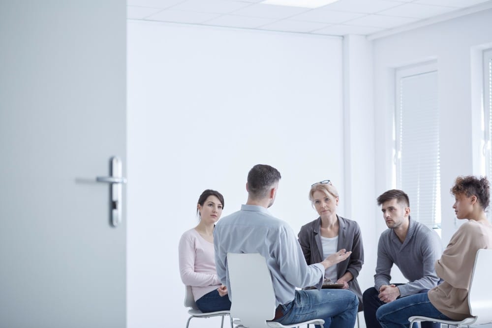 People in a small group therapy